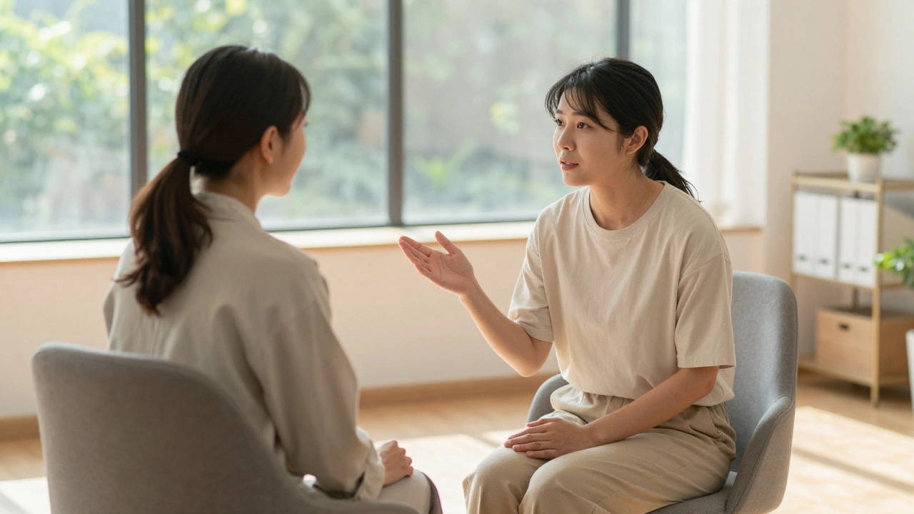 Two people talking in a sunlit therapy room, symbolizing hope and support